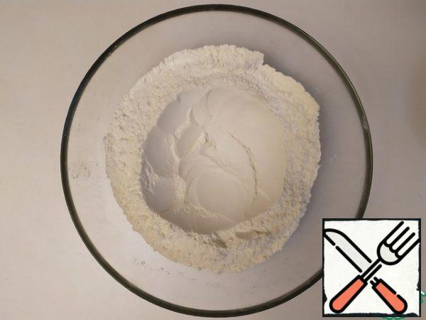 Make a nice well in flour.