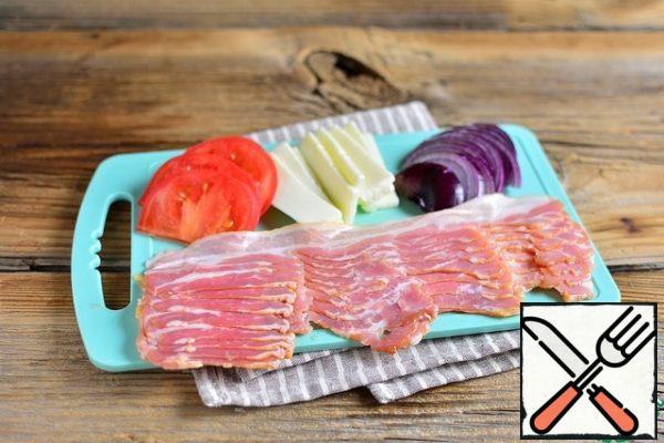 Cut and prepare the cheese, tomato, onion and bacon.