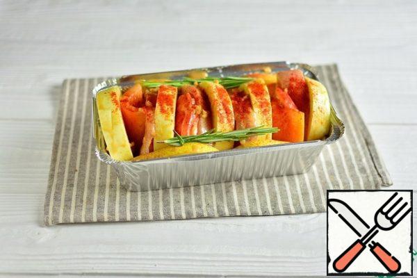 Sprinkle with paprika and add rosemary sprigs.
Cover the top with foil.