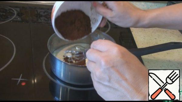 While the cake is baking, prepare the icing.  Put butter, sugar, milk and cocoa in a saucepan.  While stirring, bring to a boil, reduce heat, boil over low heat for 3-4 minutes.
