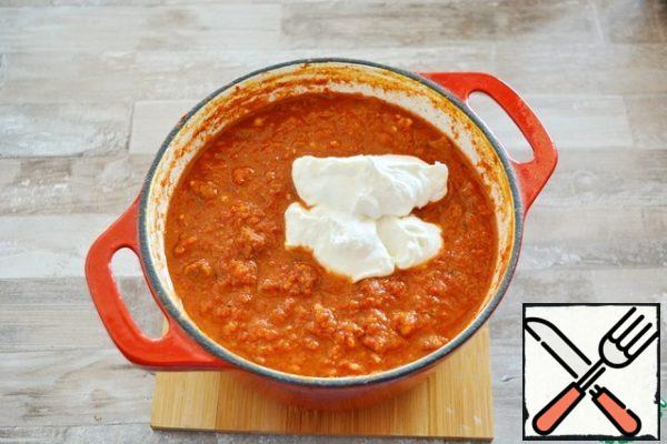 Bring to a boil, reduce the heat and simmer all together for 1.5-2 hours, stirring occasionally. When the meat is soft and the vegetables are blended into a single sauce, the dish is ready. Add the sour cream, bring to a boil and remove from the heat.

Adding sour cream is not necessary, it tastes like soup. Some people like it with sour cream, some without it.