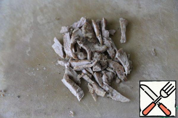 Cut the grilled turkey into strips.
