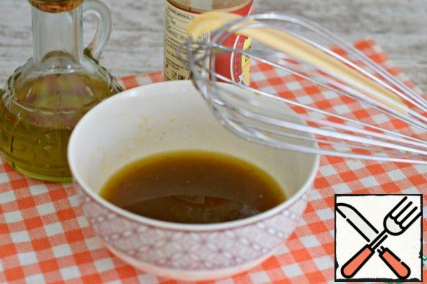 Add olive oil and soy sauce to a bowl of vegetable juice.  Mix.