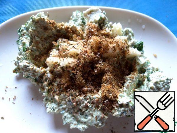 Add 2 pinches of  Khmeli-Suneli seasoning and chopped garlic clove.  Mix well.