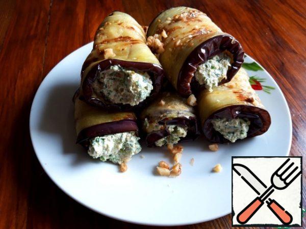 For each piece of eggplant, put about 1 tablespoon of the filling and wrap it in a roll.  The specified amount of filling is enough for about 6-7 rolls.