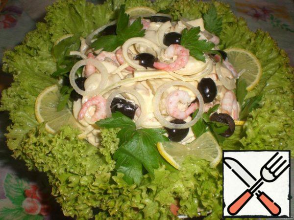 Put lettuce leaves on a dish, gently put the salad on them.  Decorate with parsley leaves.
Like this.
