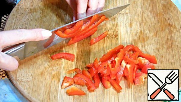 Also, cut the sweet pepper into strips.