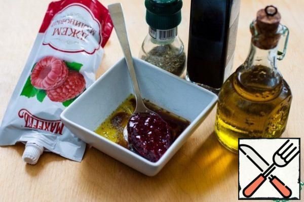 Prepare the dressing - mix olive oil, balsamic vinegar, dried Italian herbs and add raspberry jam. This wonderful delicious jam will give our dressing a taste of summer.