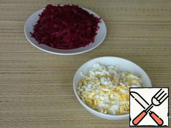 Eggs and beets are cooked until ready, cooled and grated on a large grater.