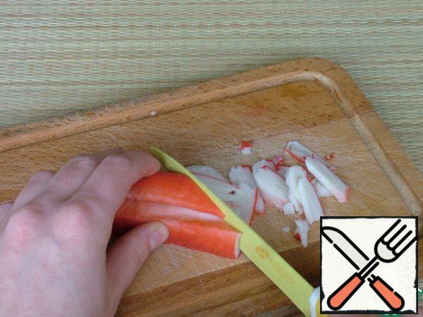 Crab sticks are cut into large slices.