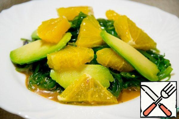 Top with thin slices of avocado and pieces of sweet orange.