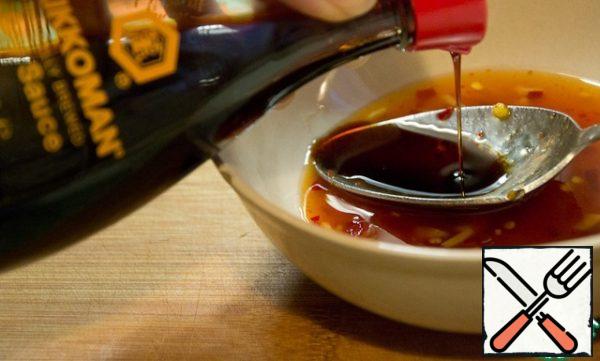 Prepare the sauce.  Combine soy sauce and sweet and sour chili.