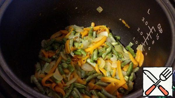 Then add the string beans and continue to saute for another 5 minutes.