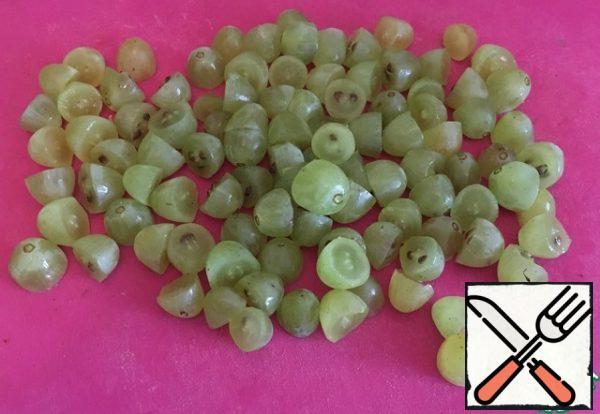 We cut the grapes in half.
