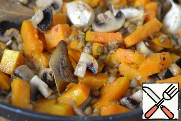 Add lentils and mushrooms to the pumpkin. Gently mix and bake for another 20 minutes.