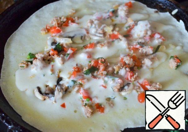 Pour 1 tablespoon of dough over the filling, bake for 1-2 minutes.