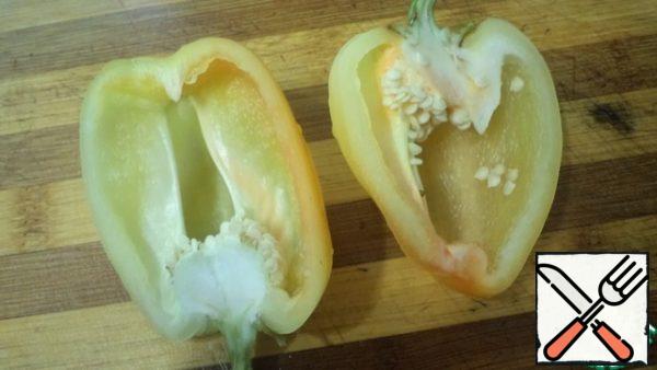I cut the peppers in half lengthwise, keeping the tail.