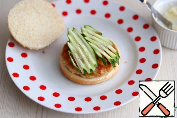 Next, add sliced fresh cucumbers.