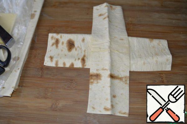 Put the strips "cross" on top of each other.