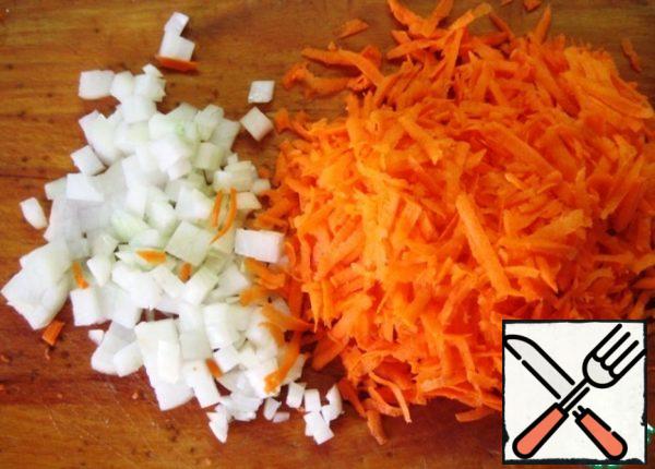 Finely chop the onion and grate the carrots.