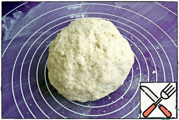 The dough should be soft and elastic. Cover with a kitchen towel and leave at room temperature for about ten minutes.
