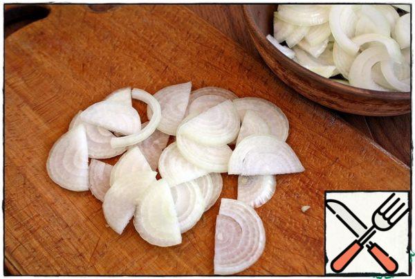 Onions cut into half rings.