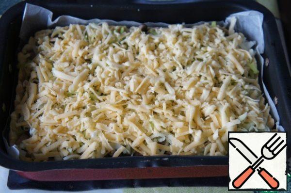 Pour the filling evenly, top with cheese and put it back in the oven. Bake at 180-200*C for 25 minutes.