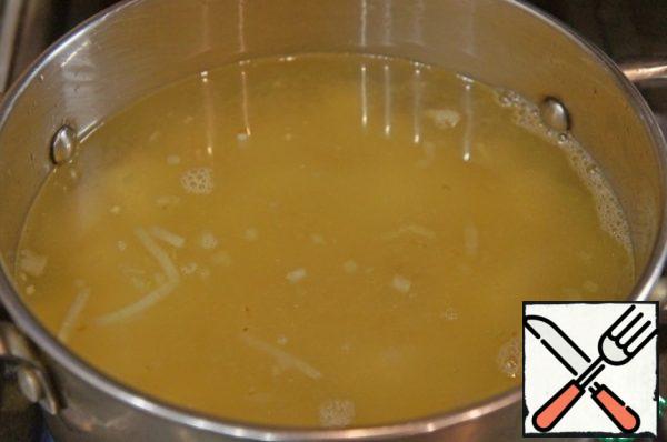 Pour in the broth, boil at a low boil for about 10-15 minutes.