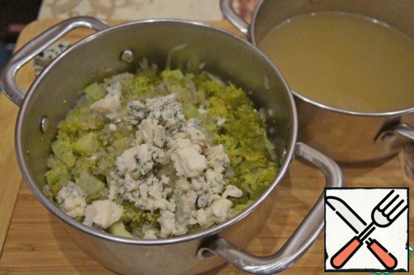 Remove the soup from the heat and drain most of the broth into a small saucepan.
