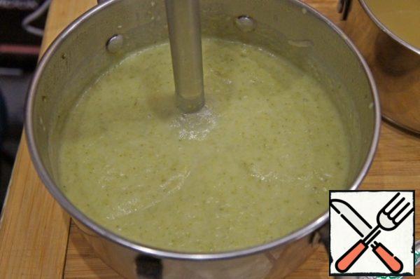 Add half the cheese to the vegetables. Beat the soup with a blender. Add salt and pepper to taste. Dilute the soup with the reserved broth to the desired consistency and warm it up again.