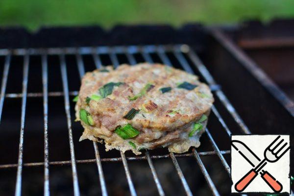 Fry burgers on moderately hot coals, turning them over until tender (it is important not to over-dry them)