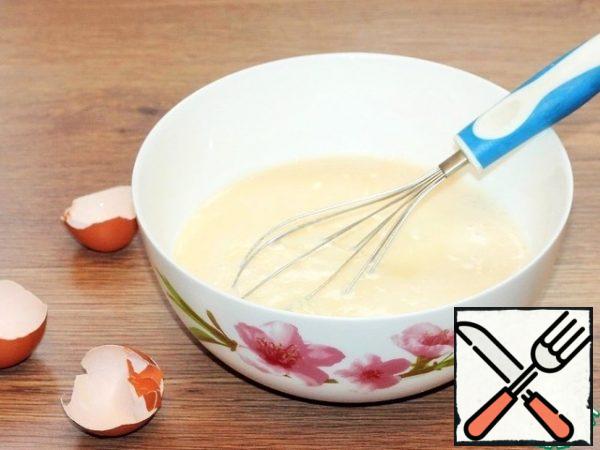Whisk the chicken eggs with a pinch of salt. Add milk.
