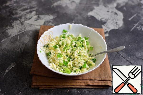 Mash or grate the cheese, combine with chopped onions and herbs.