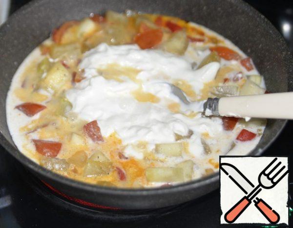 Add the sour cream mixture to the pan, stir and simmer for another couple of minutes.