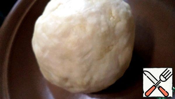 Add 4 tablespoons of ice water, if necessary, add another 1-2 tablespoons. It depends on the flour. Knead the dough and roll it into a ball. Cover it with cling film and put it in the refrigerator for 20-30 minutes.