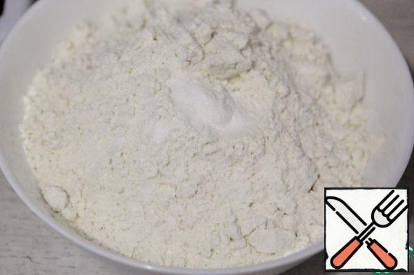 Mix flour with baking soda and baking powder, sift.