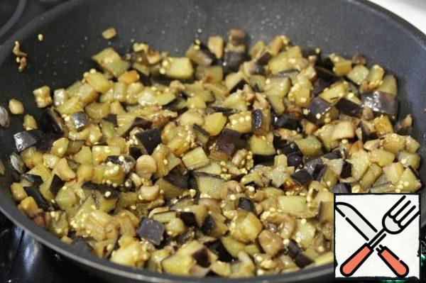 Cut the eggplant into small cubes and fry in a pan.
Season to taste with salt and pepper (I also add a little dry garlic and oregano).