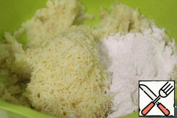 Season it with salt and ground black pepper, add starch, grated cheese, baking powder and a little oil.
