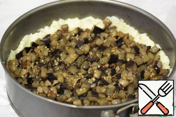 Put the fried eggplant cubes on top of it.
