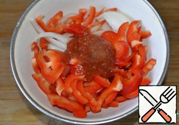 Add tomato sauce, salt, and sugar to the vegetables.