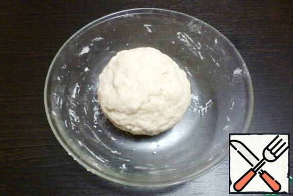 Collect the dough into a ball, wrap it in a film and leave for 30-40 minutes to rest.