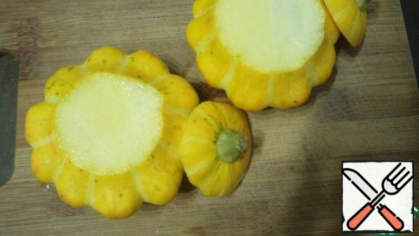 Wash and dry the squash. Cut off the tops and remove some of the pulp with the seeds.