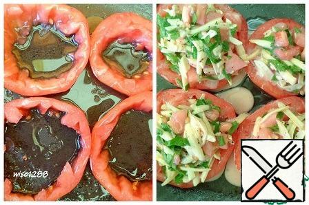 Transfer the tomato rings to a greased frying pan and place the filling in the center.