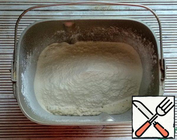 Add salt, olive oil and sift flour.