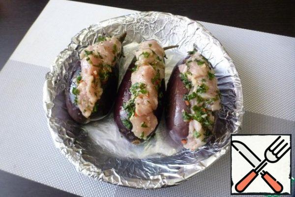 Cover the baking sheet with foil or baking paper and place the eggplant filling on top. Drizzle with olive oil.