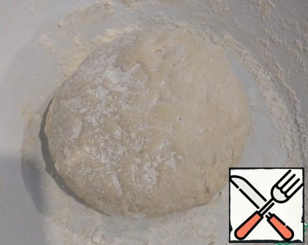 Knead the dough well, cover with a towel and put in a warm place for 40-60 minutes.