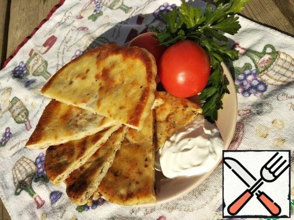 Ready-made tortillas are liberally greased with butter and served to the table. Bon appetit.