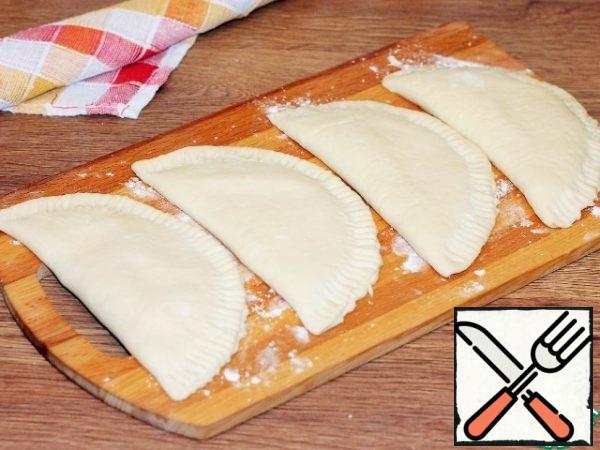 Once again, press the edges with a fork. Cover the tortillas with a dry towel and allow 15-20 minutes, the dough to settle a little.