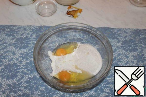 Add sugar and eggs to the flour.