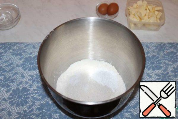 Add baking powder, sugar and salt to the sifted flour. Mix well.